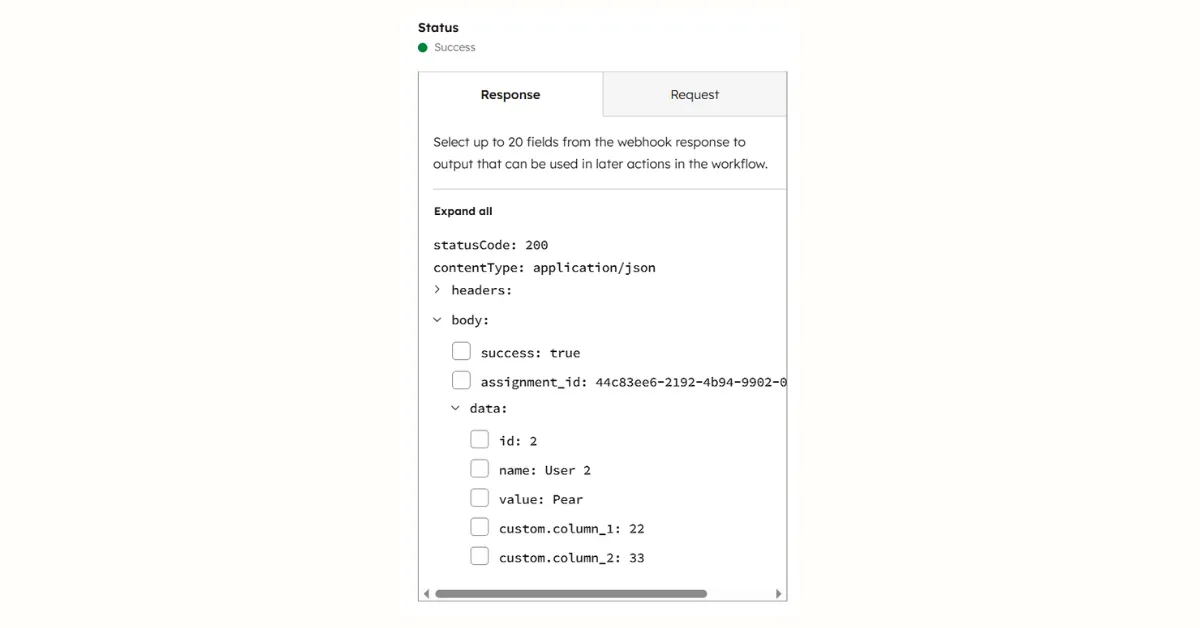 HubSpot webhook test response showing Status Success with statusCode 200, response body containing success true, assignment_id, and data object with id, name, value, and custom columns